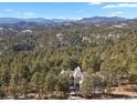 Luxury home with mountain views and forest landscape at 25220 Montane Dr, Golden, CO 80401
