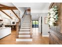 Bright foyer showcasing hardwood floors, staircase, and open layout to the living spaces at 5810 S Galena St, Greenwood Village, CO 80111