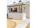 Up close look at the home's front porch area and exterior features at 1010 N Jasmine St, Denver, CO 80220
