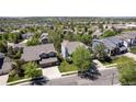 Neighborhood aerial view showing lush landscaping and mature trees with a beautiful sky overhead at 20234 E Lake Cir, Centennial, CO 80016