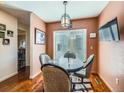 Cozy dining area with a sliding door to outdoor view and seating for four at 3002 E Long S Cir, Centennial, CO 80122