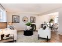 Bright and airy living room with modern decor, stylish furnishings, and ample natural light at 1494 S Yampa Ct, Aurora, CO 80017