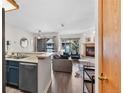 Living room with open floor plan to the kitchen and cozy fireplace at 100 S Park Ave # E312, Breckenridge, CO 80424