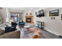 Comfortable living room with a cozy fireplace and stylish decor creates a relaxing ambiance at 100 S Park Ave # E312, Breckenridge, CO 80424