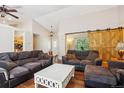 Spacious living room with hardwood floors, vaulted ceiling, and barn door features, perfect for relaxing at 8095 Bannock Dr, Larkspur, CO 80118