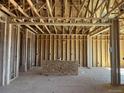 Interior framing with visible studs, wiring, and plumbing offer opportunity to design this unfinished home at 901 Coal Bank Trl, Castle Rock, CO 80104