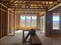 Sunlit interior displays unfinished construction with large windows overlooking outdoor area at 901 Coal Bank Trl, Castle Rock, CO 80104