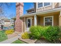 Inviting townhome exterior with vibrant landscaping and clear address display at 14271 E Dickinson Dr # F, Aurora, CO 80014