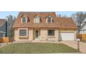 Traditional brick home with a well-kept lawn, offering a welcoming and classic curb appeal at 3873 W 98Th Ave, Westminster, CO 80031