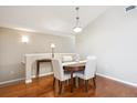 Dining area featuring hardwood floors, neutral paint, and modern lighting at 8638 Gold Peak Dr # D, Highlands Ranch, CO 80130