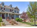 Charming two-story home with a welcoming front porch and landscaped yard at 4401 Hydrangea Way, Castle Rock, CO 80109