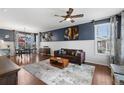 Comfortable living room featuring hardwood floors and a stylish decor at 4401 Hydrangea Way, Castle Rock, CO 80109