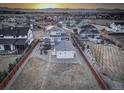 Beautiful aerial view of the property showcasing the backyard, neighborhood, and mountain views at 785 Delechant Dr, Erie, CO 80516