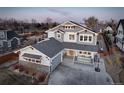 Lovely home with ample driveway, a manicured lawn, and an inviting covered porch perfect for relaxing at 785 Delechant Dr, Erie, CO 80516