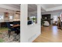 The open-concept design seamlessly connects the kitchen, dining area, and living room, creating a cohesive living space at 785 Delechant Dr, Erie, CO 80516