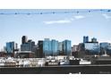 Expansive city skyline view with modern architecture and clear blue sky at 1878 W 32Nd Ave, Denver, CO 80211