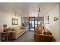 Comfortable lobby space with a couch, leather chairs, and plants at 3675 S Cherokee S St # 710, Englewood, CO 80110