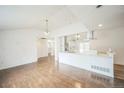 Bright, open living room flows into the kitchen with stainless steel appliances at 7010 W 44Th Ave, Wheat Ridge, CO 80033