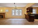 Open floor plan with a fireplace and bar area, perfect for entertaining at 321 S Gilpin St, Denver, CO 80209