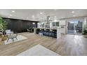 Spacious kitchen with island, black accent wall and modern appliances at 10508 W Chautauga Mtn, Littleton, CO 80127