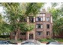 Charming brick apartment building with Tudor-style details and landscaped entrance at 1060 N Washington St # 301, Denver, CO 80203