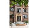 Brick building entrance with prominent address and decorative stone trim at 1060 N Washington St # 301, Denver, CO 80203