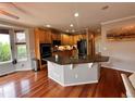 Spacious kitchen with granite countertops, stainless steel appliances, and hardwood flooring at 11895 Hitching Post Ct, Parker, CO 80134