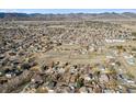 Wide aerial view of the neighborhood and its location with mountains in the distance at 7770 S Estes St, Littleton, CO 80128