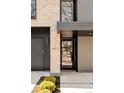 Home entrance featuring modern house numbers on the exterior and a view to the entryway at 633 Dexter St, Denver, CO 80220