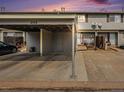 Exterior elevation showing carport and entrance to home in a townhome-style property at 8746 Carr Loop, Arvada, CO 80005