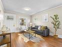Bright living room featuring hardwood floors, ample natural light and contemporary furnishings at 1987 S Downing St, Denver, CO 80210