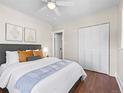 Comfortable bedroom featuring hardwood floors, a ceiling fan and a closet at 1987 S Downing St, Denver, CO 80210