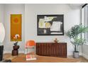 Chic living room showcasing stylish furniture, artistic details, and hardwood flooring at 1286 Raleigh St, Denver, CO 80204