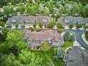 Scenic view of townhomes with lush green lawns and mature trees at 1441 S Ulster St, Denver, CO 80231