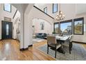 Bright living room features archways, hardwood floors, and large windows with great natural lighting at 6985 Fallon Cir, Castle Rock, CO 80104