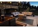 Inviting outdoor patio with comfortable seating and stylish string lights for evening enjoyment at 6985 Fallon Cir, Castle Rock, CO 80104
