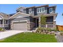 Charming two-story home featuring stone accents, a covered front porch, a well-maintained lawn and two car garage at 1281 Loraine N Cir, Lafayette, CO 80026