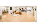 Spacious living room with hardwood floors and an open floor plan at 26631 E Arbor Dr, Aurora, CO 80016