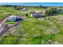 Large backyard with a spacious, unfinished area and detached garage with plenty of parking at 1166 Belgian Trl, Elizabeth, CO 80107