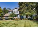 Charming home with a well-manicured lawn and beautiful landscaping, creating inviting curb appeal at 4483 W Cottonwood Pl, Littleton, CO 80123