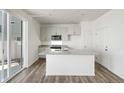 Bright kitchen with granite countertops, stainless steel appliances, and center island at 22113 E 38Th Pl, Aurora, CO 80019