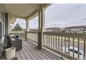 Spacious front porch offers views of the community at 9519 Pearl Cir # 105, Parker, CO 80134