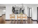 Modern kitchen featuring breakfast bar with seating and views to the living space at 1900 E Girard Pl # 505, Englewood, CO 80113