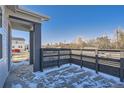 Cozy patio with a privacy fence, ideal for outdoor relaxation and entertainment with a private outdoor space at 2484 W 69Th Pl, Denver, CO 80221
