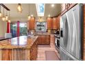 Modern kitchen featuring stainless steel appliances, granite counters, and ample cabinet space at 30273 Conifer Rd, Evergreen, CO 80439