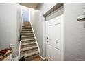 Staircase leading to the upper level of the home at 10587 Parkington Ln # B, Highlands Ranch, CO 80126