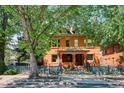 Charming two-story brick home with a covered front porch and a lovely fenced yard at 1401 N Franklin St # 1, Denver, CO 80218
