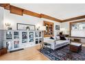 Cozy living room with hardwood floors, built-in shelving, and abundant natural light at 1401 N Franklin St # 1, Denver, CO 80218