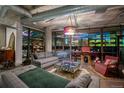 Inviting living room featuring comfortable seating, unique decor, and stunning city views through expansive windows at 2100 16Th St # 412, Denver, CO 80202