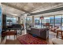 Bright living space with a piano, area rug, comfortable seating, and an open ceiling at 2100 16Th St # 412, Denver, CO 80202